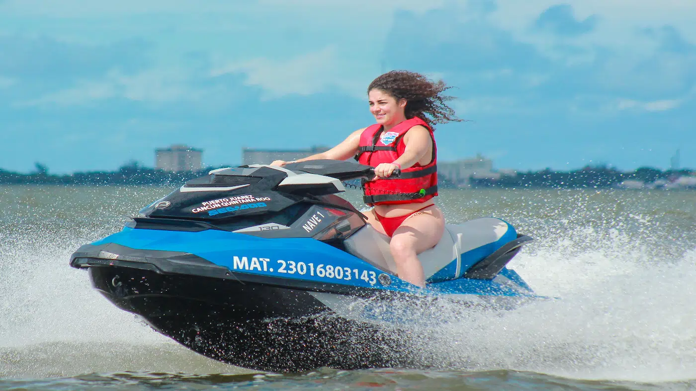 A beatiful girl riding a Jet Ski in Cancun
