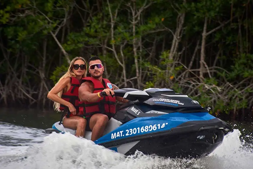 Guys on a Cancun jungle tour on a speedboat