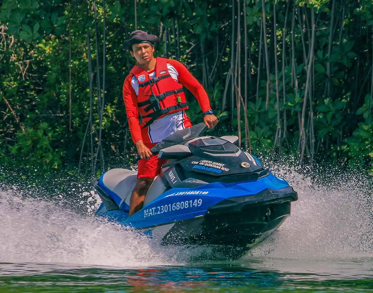 A jet ski instructor in Cancun leads clients on a ride around the Nihupte lagoon